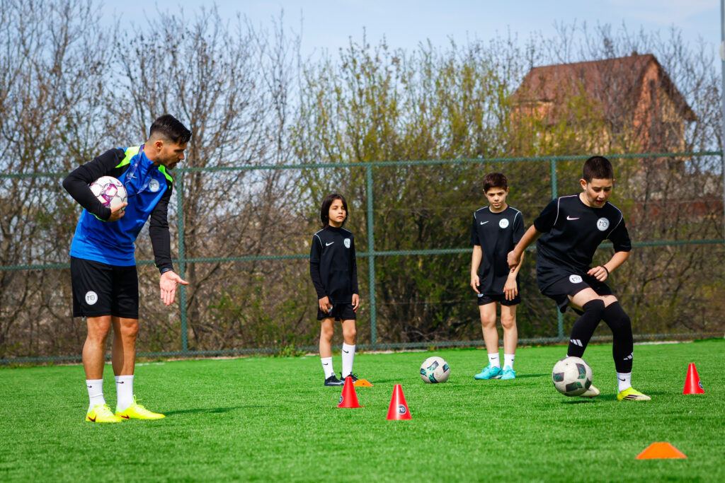 coach Carles Coto with players